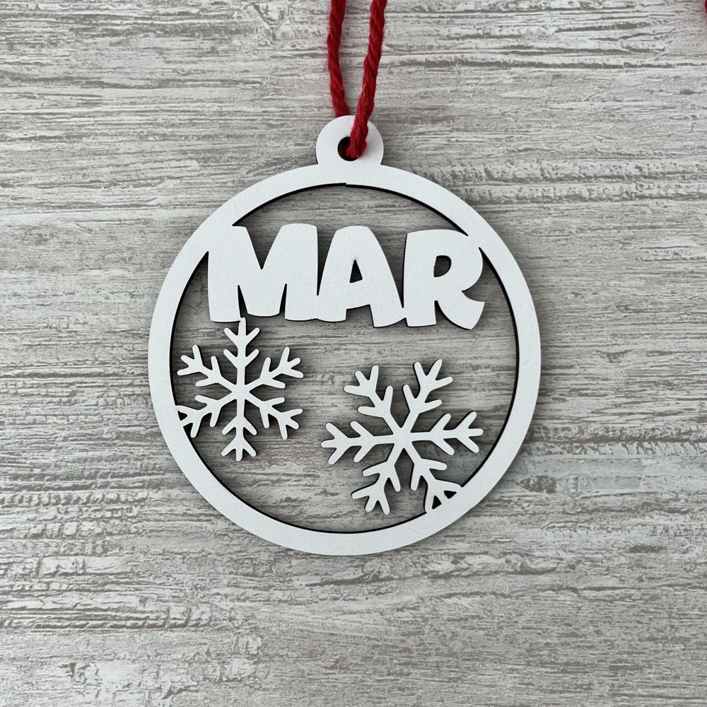 Bola de madera con copos de nieve